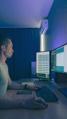 The young man works at a computer. time lapse