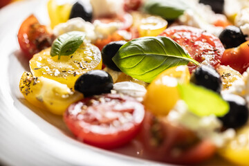 Canvas Print - Caprese salad, mediterranean food, is served in white plate