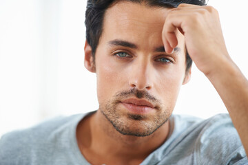 Wall Mural - Serious man, closeup and face of handsome model or resting hand on head on isolated and white background. Portrait of Spanish male person, clean skin or facial aesthetic with confidence and blue eyes