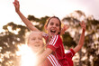 © Austockphoto - Happy football team of tween girls celebrating together
