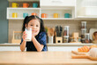 © Nunkung - Cute little girl holding a glass of milk in the kitchen to drink milk for breakfast,Food and health nutrition beverage concept.