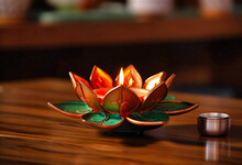 Gold Lotus Candle Holder On A Wooden Table