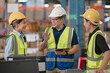 © MAGNIFIER - Managers and employees are counting stocks in a warehouse.