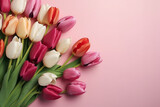 Fototapeta Tulipany - Beautiful bouquet of colorful tulip flowers on pink background, top view, Space for text generative AI technology