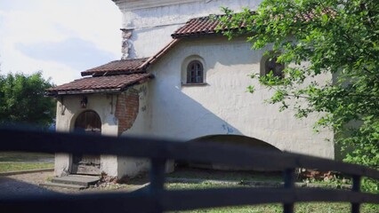 Poster - Russia Vyborg 06.06.2023 An old house with eyes and a mouth in the city.