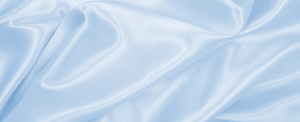 Wall Mural - Smooth elegant blue silk or satin luxury cloth texture as abstract background. Luxurious background design