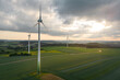 Wind farm in beautiful landscape in the sunset with backlight seen from an aerial view