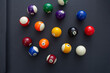 © DAVID - A top down view of a pool balls on a blue felt table.