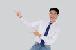 © N_studio - Portrait young asian business man pointing and presenting isolated on white background, advertising and marketing, executive and manager, businessman confident showing something with expression.
