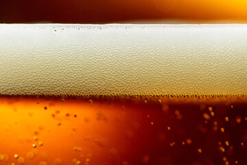 Glass of tasty beer with foam, closeup.