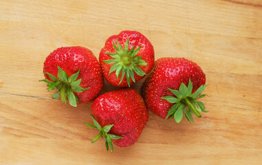 Wall Mural - strawberries on wooden background