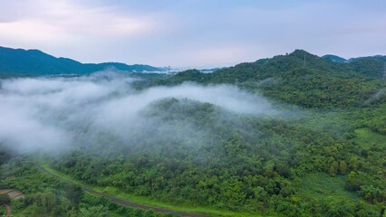 Wall Mural - 4k motion time lapse video aerial view morning scenery mist flowing over the high mountains the move