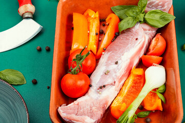 Wall Mural - Raw pork tenderloin in a baking dish.