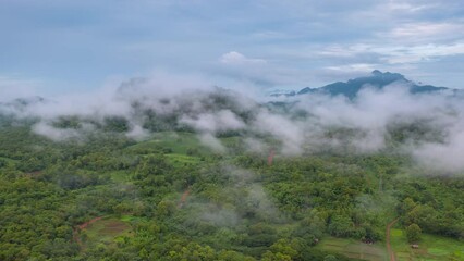 Wall Mural - 4k motion time lapse video aerial view morning scenery mist flowing over the high mountains the move