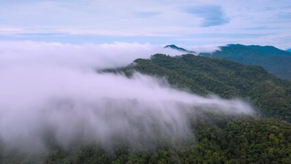 Wall Mural - 4k motion time lapse video aerial view morning scenery mist flowing over the high mountains the move