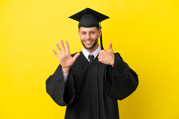 Wall Mural - Young university graduate caucasian man isolated on yellow background counting six with fingers