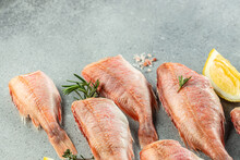 Fish, Red Snapper With Lemon, Rosemary, Salt On A Light Background. Healthy Food Concept. Place For Text, Top View
