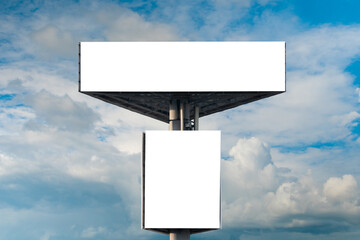 Wall Mural - front view: two blank white billboards or large displays against blue sky with white clouds - mock u