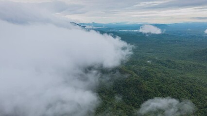Wall Mural - 4k motion time lapse video aerial view morning scenery mist flowing over the high mountains the move