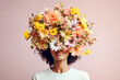Leinwandbild Motiv Woman with her head covered with flowers. Mental health, psychological treatment concept. Happiness and joy, dreaming. Psychology theme, thinking positive, having good thoughts in mind. AI generated