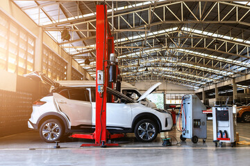 Wall Mural - car in automobile repair service center with soft-focus and over light in the background