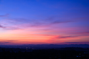 evening time of panorama mountain under dramatic twilight sky and cloud. nightfall silhouette mounta