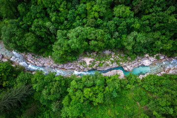 Canvas Print - Soca river in Slovenia. Aerial drone top down view of emerald green river in forest