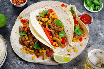 Wall Mural - Mexican Tacos with Beef and Vegetables, Tacos al Pastor on Dark Background