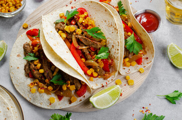 Wall Mural - Mexican Tacos with Beef and Vegetables, Tacos al Pastor on Grey Background