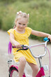 © Evgenia Tiplyashina - Girl to learn to ride a bike.