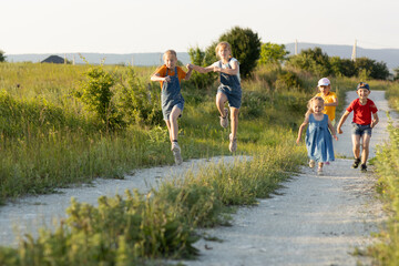 children on a walk in the summer