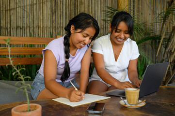 Cheerful latin woman taking notes