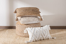 Decorative Pillows And Cushions, Basket And Blanket With Tassels On White Background
