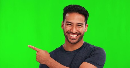 Wall Mural - Pointing, list and face of Asian man on green screen for promotion, offer and mockup space. Advertising, decision and portrait of male person for process, news and information hand gesture in studio