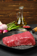 Wall Mural - Closeup view of uncooked beef steak boneless on grill pan