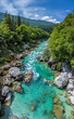 Soca Valley, Slovenia - Aerial panoramic view of the emerald alpine river Soca on a bright sunny summer day with Julian Alps, blue sky and green foliage
