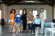 © Westend61 - Happy business colleagues standing together in office