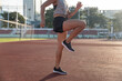 © Westend61 - Young athlete warming up for exercise in sports field