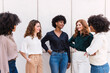 © Westend61 - Smiling businesswomen together spending time in front of wall
