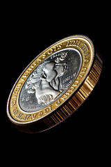 Poster -  A macro photograph of a falling dollar coin captured in motion, creating a sense of movement and capturing the dynamic nature of currency fluctuations. Generative AI technology.