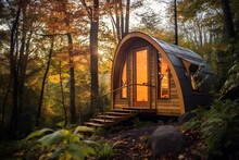 An Enticing Photo Of A Uniquely Designed Tiny Home Nestled Amidst Lush Nature, Representing The Trend Towards Sustainable And Minimalist Living.