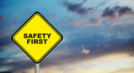 Wall Mural - Yellow safety first sign. 