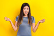 Photo of negative emotion shrug shoulders vietnamese girl wear t-shirt wtf misunderstanding argument isolated on yellow color background