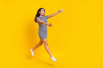 Wall Mural - Full length photo of sweet impressed woman dressed striped outfit hugging embracing empty space isolated yellow color background