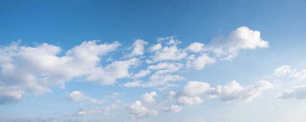 Wall Mural - horizontal blue sky, with floating cumulus clouds, natural backgrounds