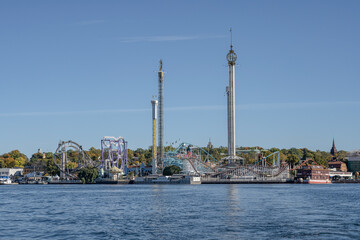 Wall Mural - View of amusement park Grona Lund with carousels and tour rides on Djurgarden island Stockholm Sweden