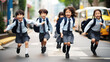© Natalia - Asian school children wearing school bags running happily back to school