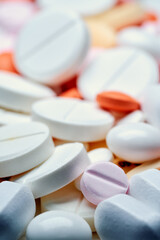 Medicine and drug concept. Close up shot of white and colored pills  of different kinds.