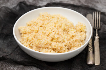 Wall Mural - Tasty fresh boiled quinoa in white bowl