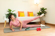 © freebird7977 - Healthy lifestyle young woman fitness gym for body slim. Young people girl exercise at living room on line. Fitness instructor exercising the fitness. Diet and Healthy sport Concept